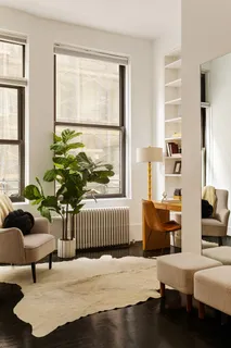 a bedroom with furniture and a window