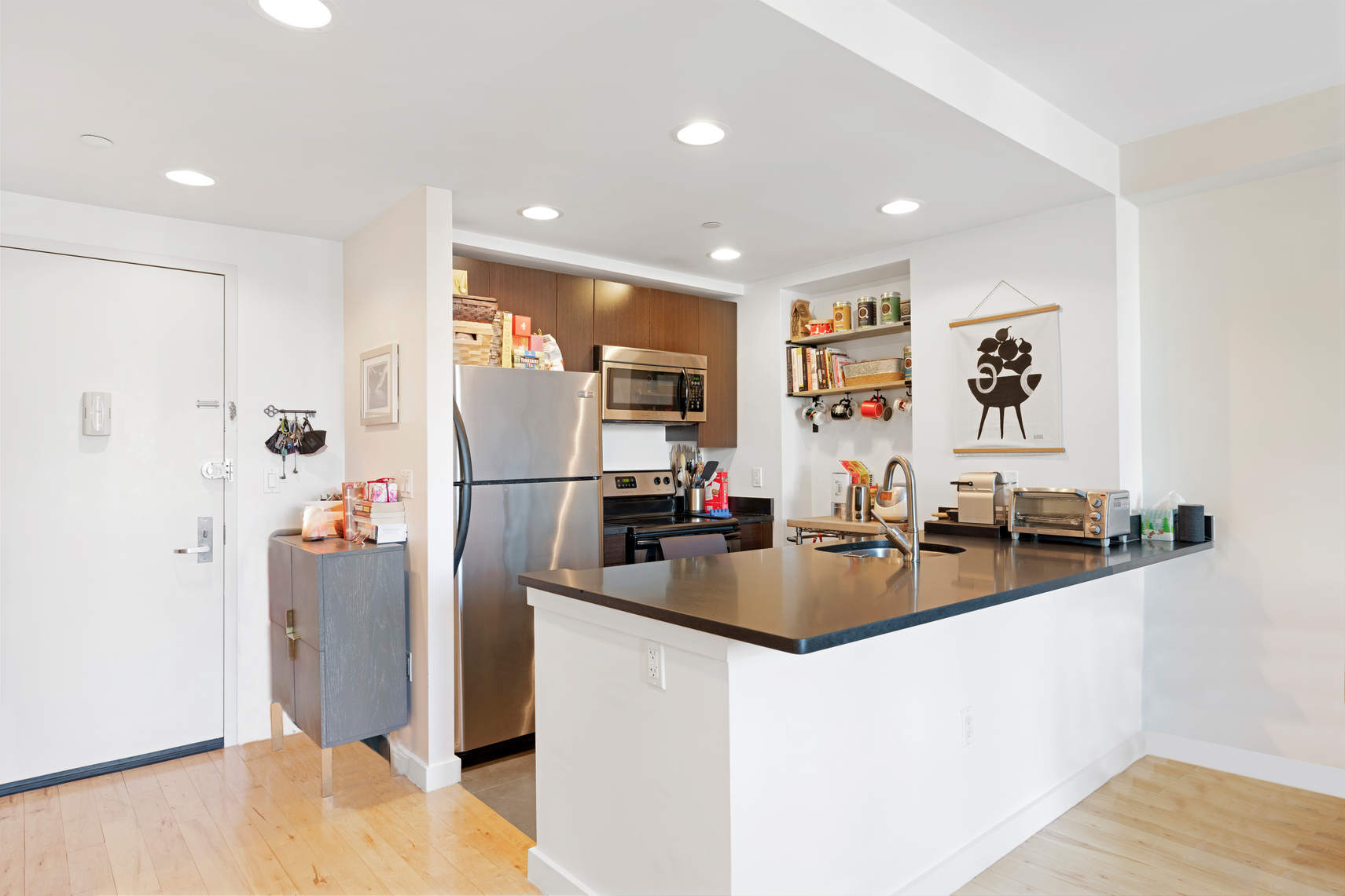 1595 Lexington Avenue, Unit 4H Manhattan, NY 10029 - Photo 2 of 9 a view of a living room and kitchen