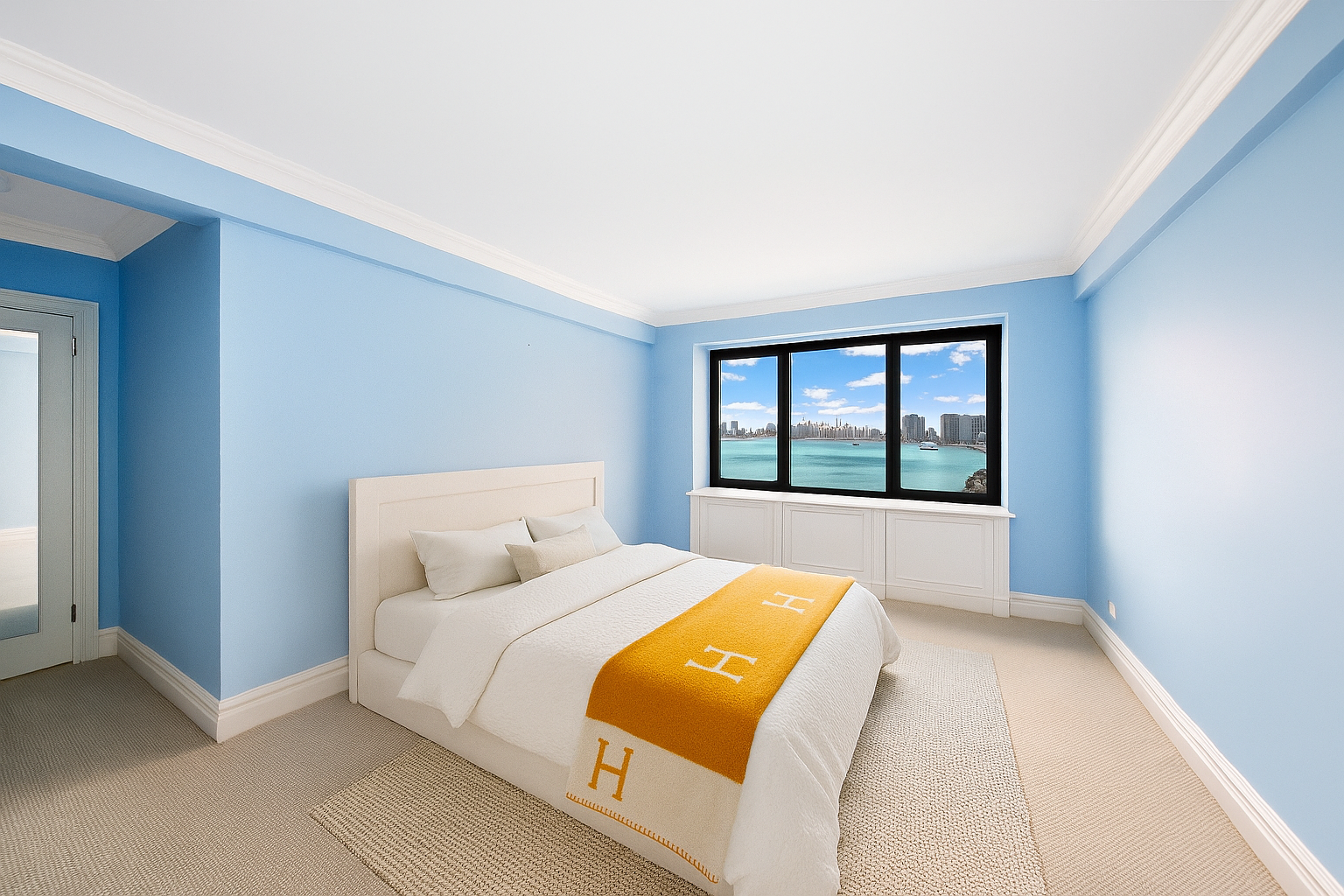 45 Sutton Place South, Unit 8L Manhattan, NY 10022 - Photo 8 of 22 a bed sitting in a bedroom next to a window