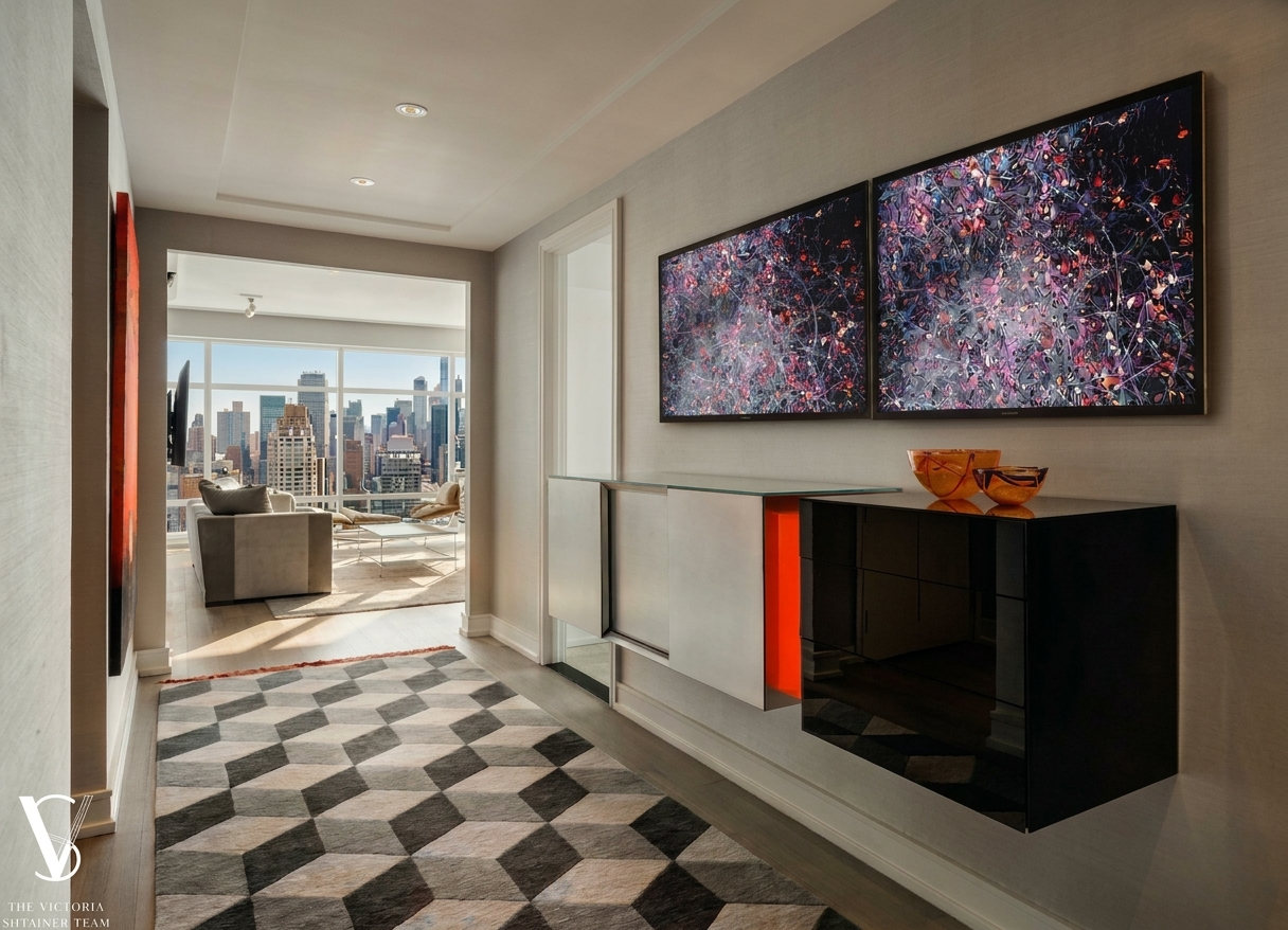 151 East 58th Street, Unit 38A Manhattan, NY 10022 - Photo 8 of 13 a view of a hallway with a painting on the wall