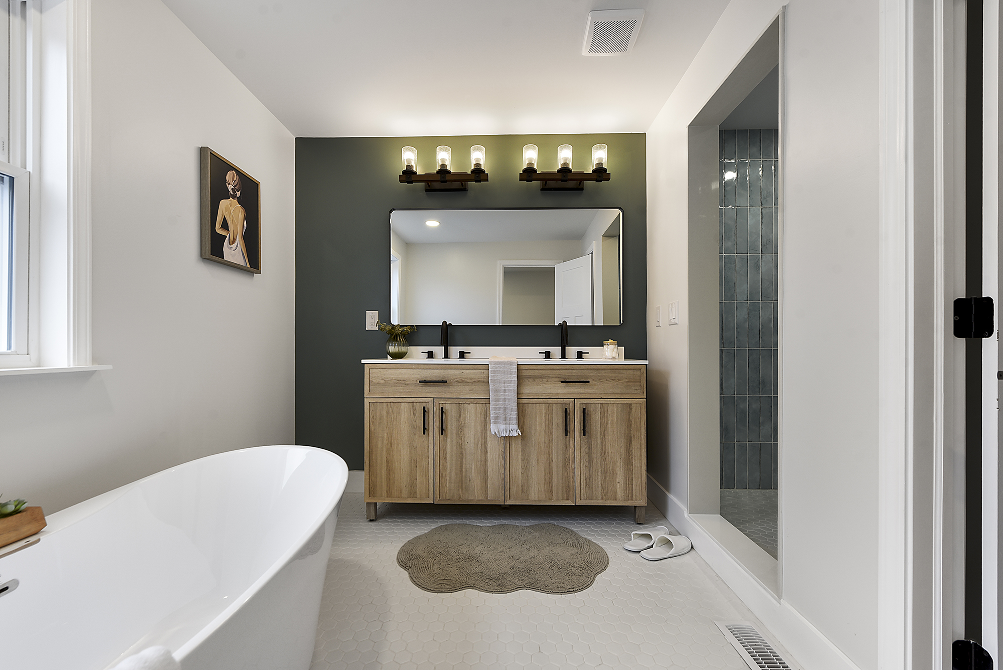 5412 Carnegie Street Pittsburgh, PA 15201 - Photo 40 of 55 a bathroom with a sink a mirror and a bathtub