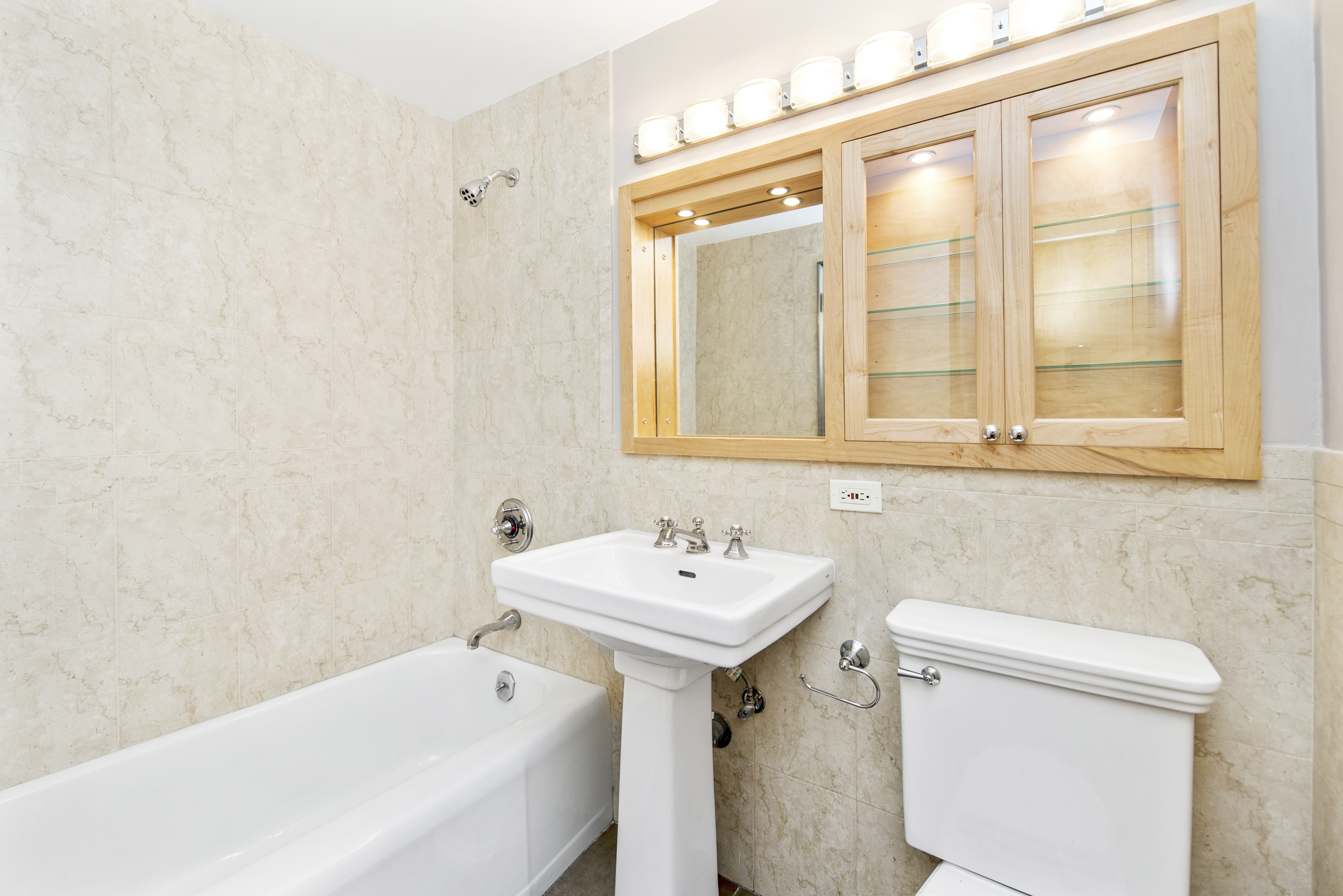 80 Park Avenue, Unit 9L Manhattan, NY 10016 - Photo 6 of 10 a bathroom with a sink and a toilet
