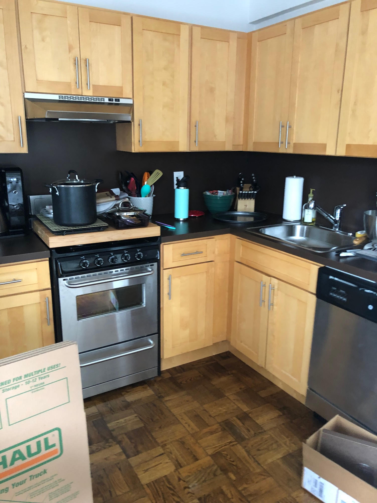 510 East 85th Street, Unit 11A6 Manhattan, NY 10028 - Photo 4 of 8 a kitchen with a stove a sink and cabinets