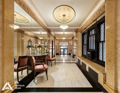 a very nice looking room with a large window and furniture