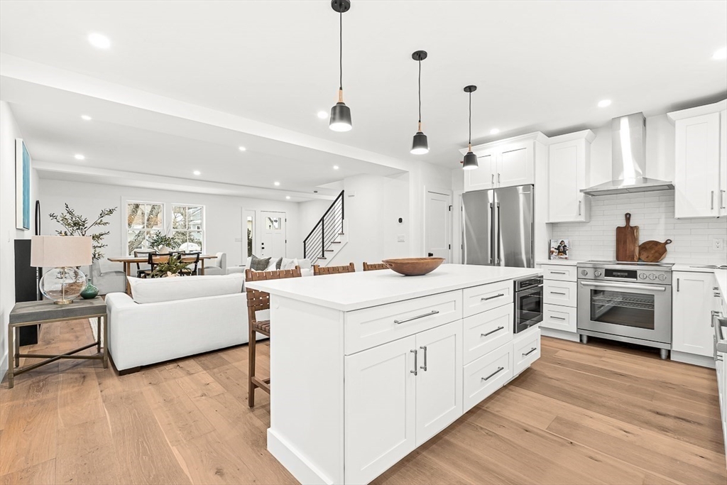 6 Intervale Road Wellesley, MA 02481 - Photo 5 of 33 a large white kitchen with cabinets a sink and a stove
