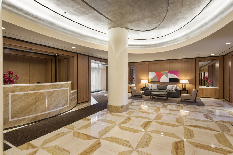 200 East 94th Street, Unit 2309 Manhattan, NY 10128 - Photo 11 of 17 a living room with furniture a flat screen tv and rug