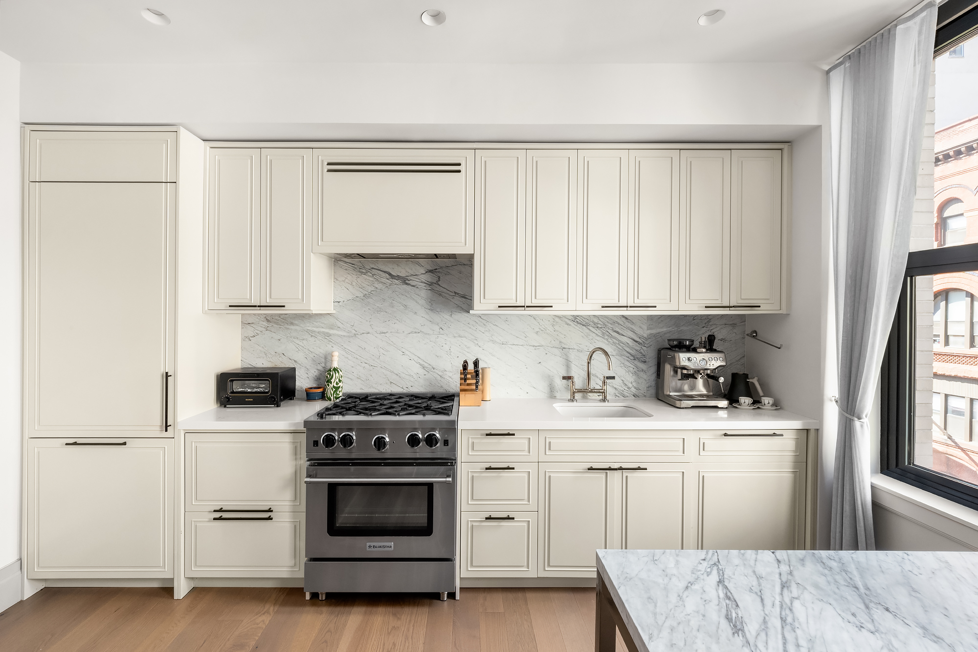 76 Schermerhorn Street, Unit 4C Brooklyn, NY 11201 - Photo 5 of 10 a kitchen with a stove a sink and a refrigerator