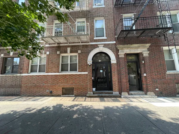 a front view of a house with a empty space