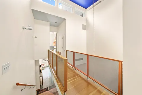 a view of a hallway with seating area