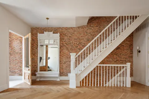a view of staircase with large window