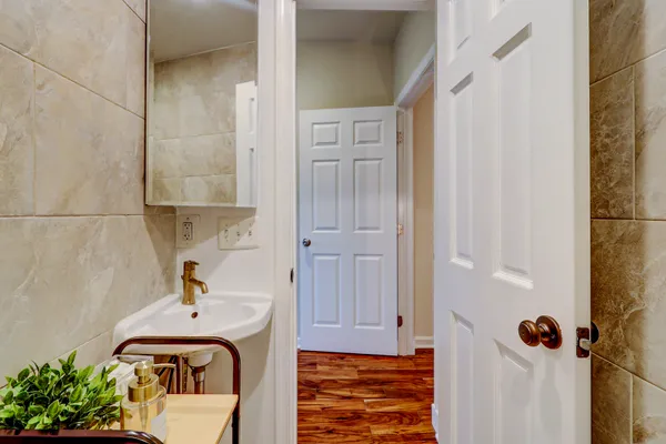 a bathroom with a sink and shower