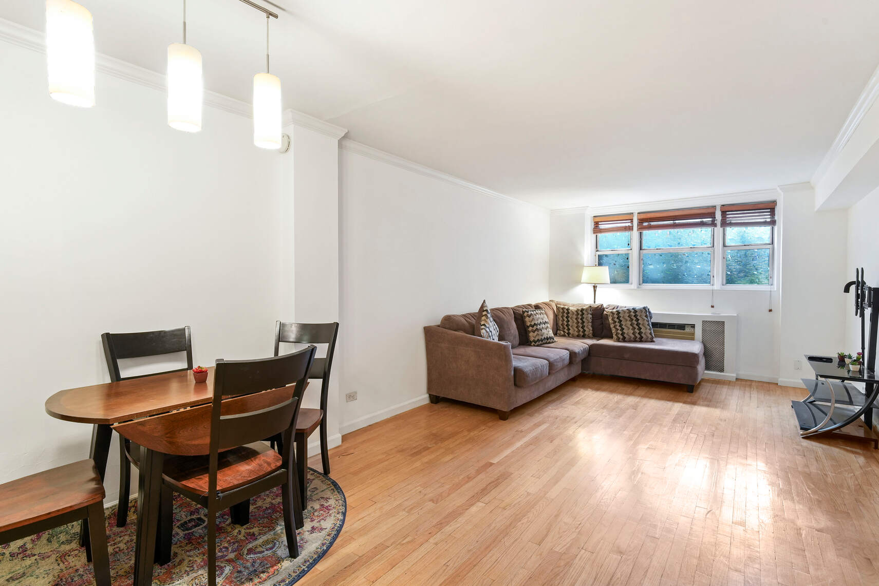321 East 45th Street, Unit 1F Manhattan, NY 10017 - Photo 2 of 14 a living room with furniture and a wooden floor