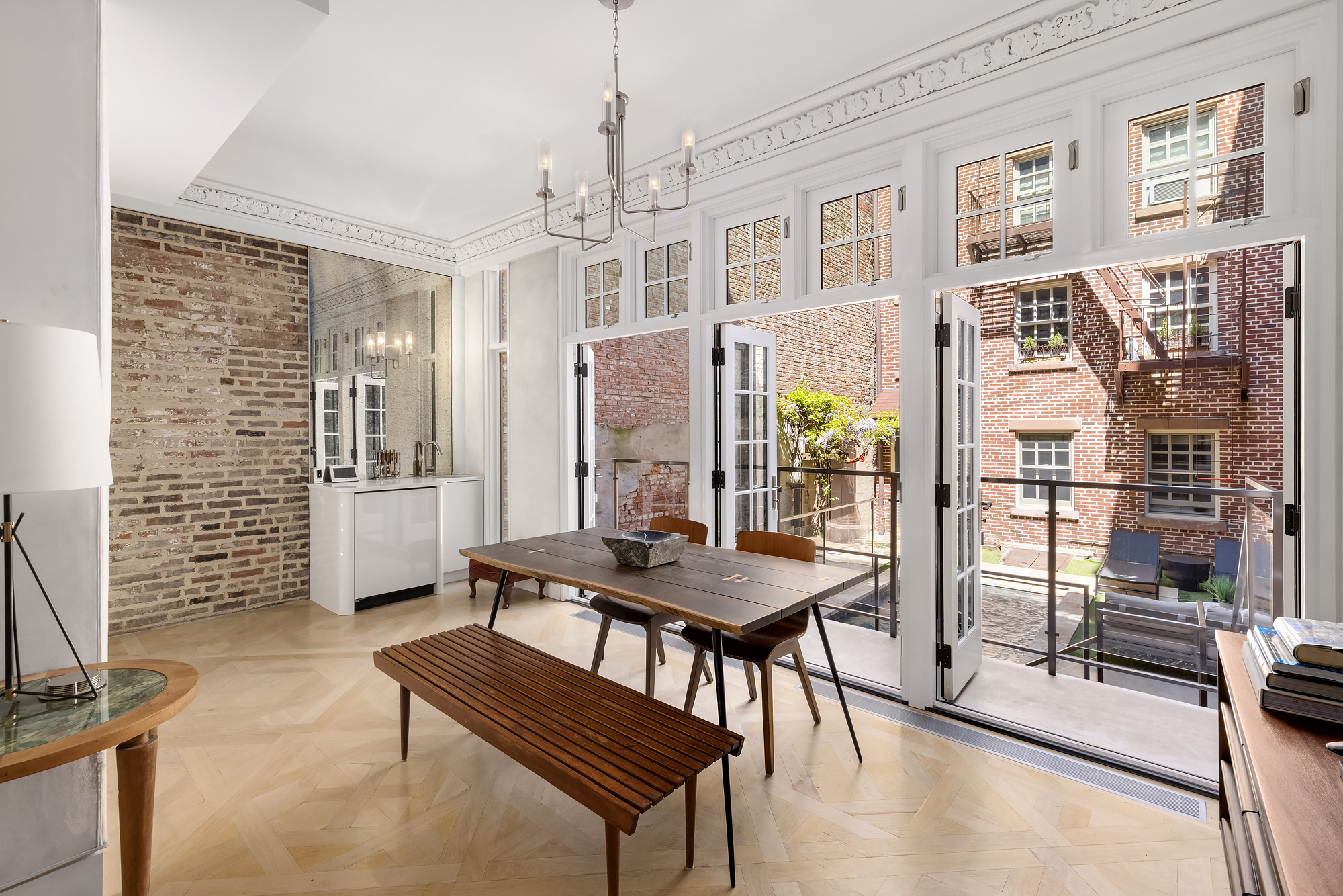 21 Cornelia Street Manhattan, NY 10014 - Photo 2 of 26 a view of a livingroom with furniture and floor to ceiling window