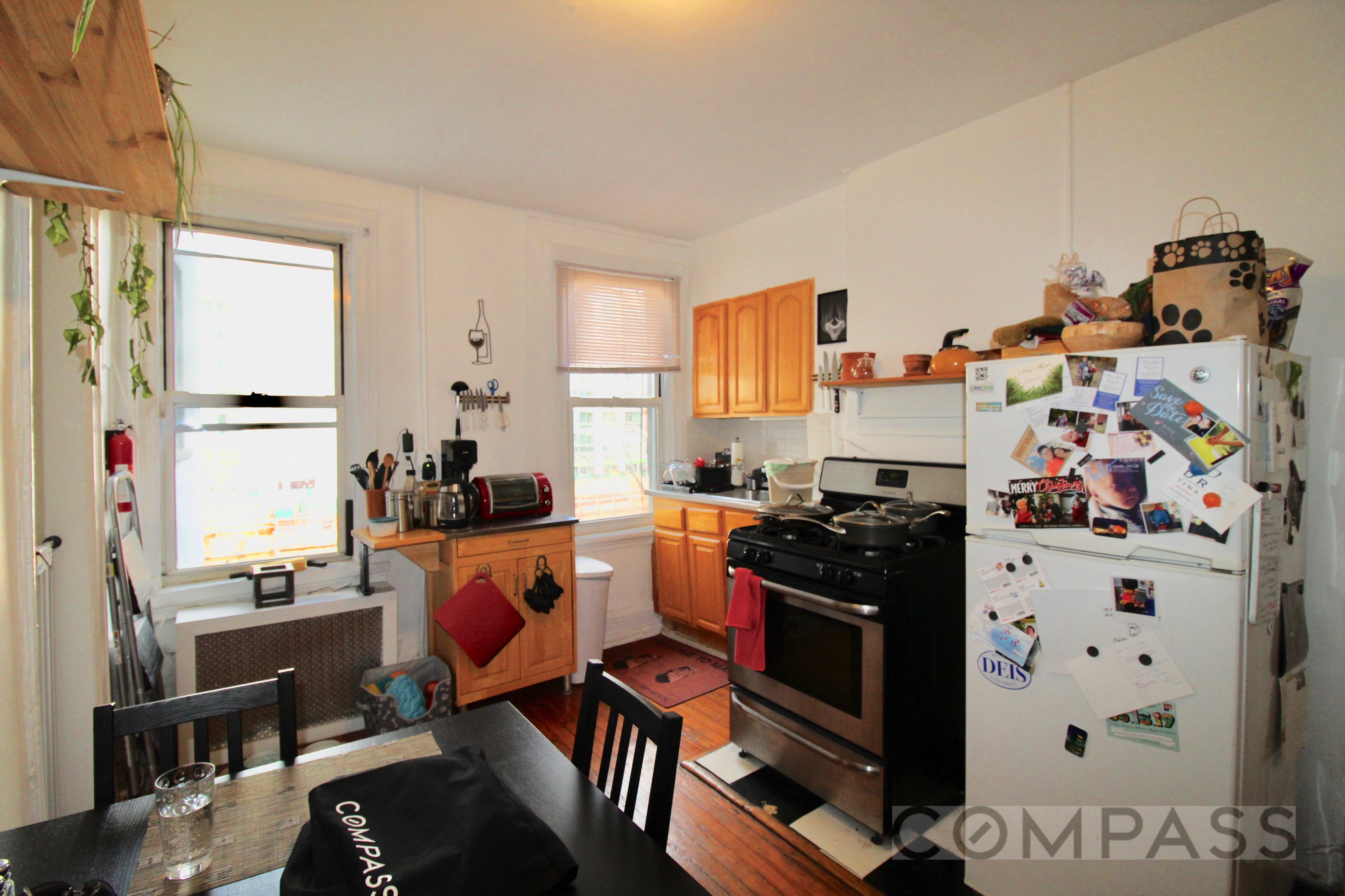 53 Duffield Street, Unit 3 Brooklyn, NY 11201 - Photo 9 of 11 a kitchen with stainless steel appliances a stove a sink and a refrigerator