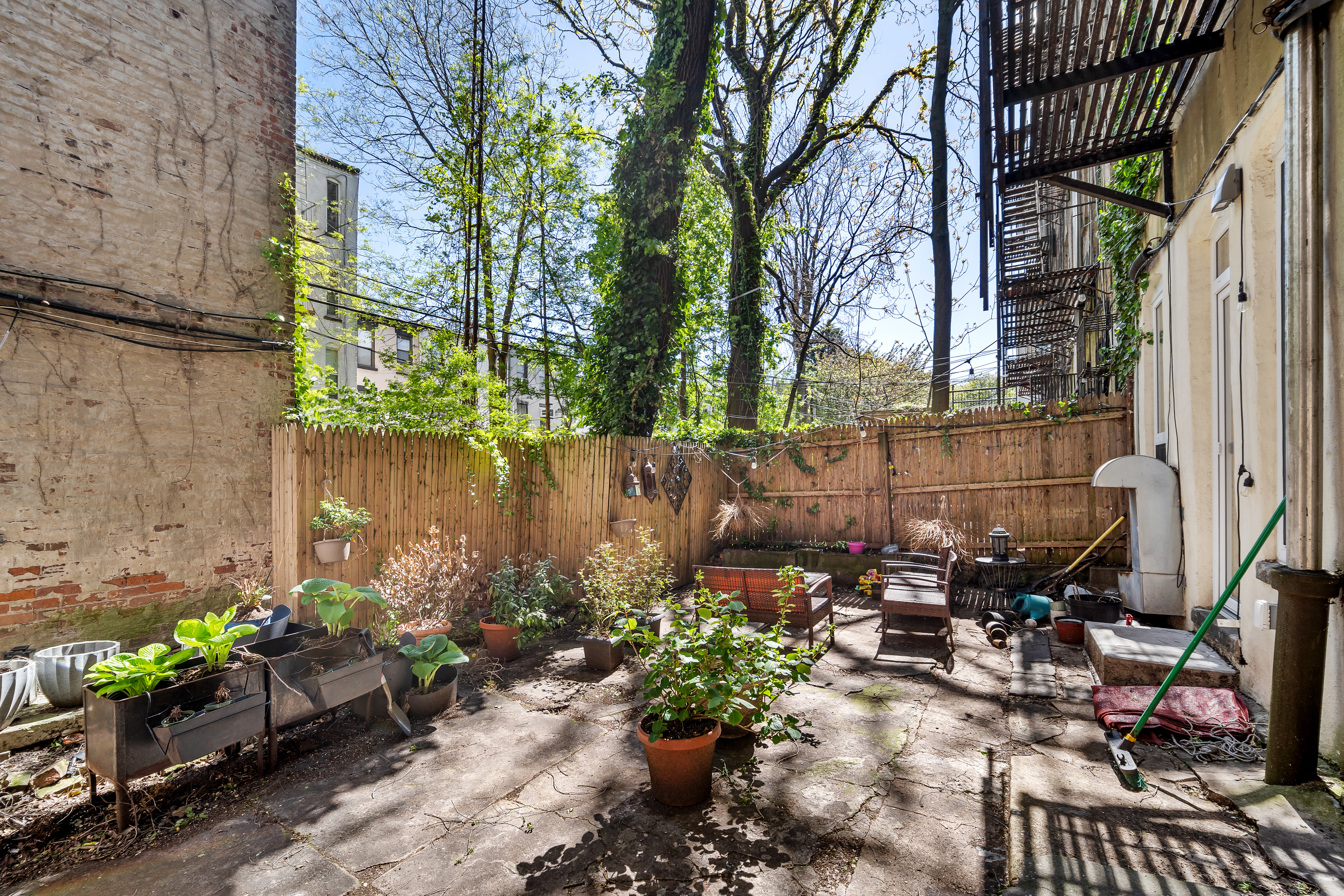 353 12th Street, Unit 2 Brooklyn, NY 11215 - Photo 10 of 17 a backyard of a house with lots of green space