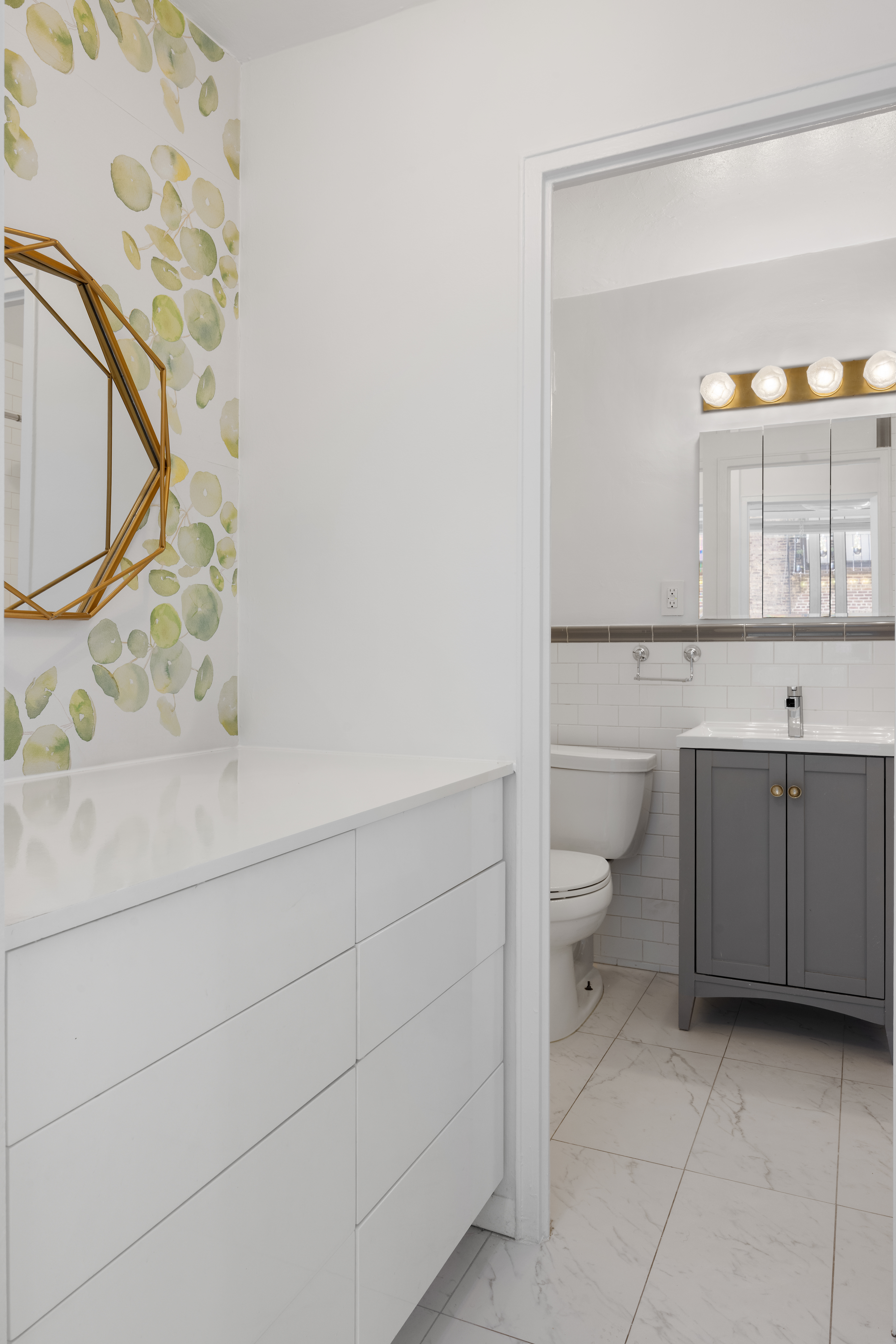 333 East 14th Street, Unit 4N Manhattan, NY 10003 - Photo 11 of 13 a bathroom with a toilet sink and mirror