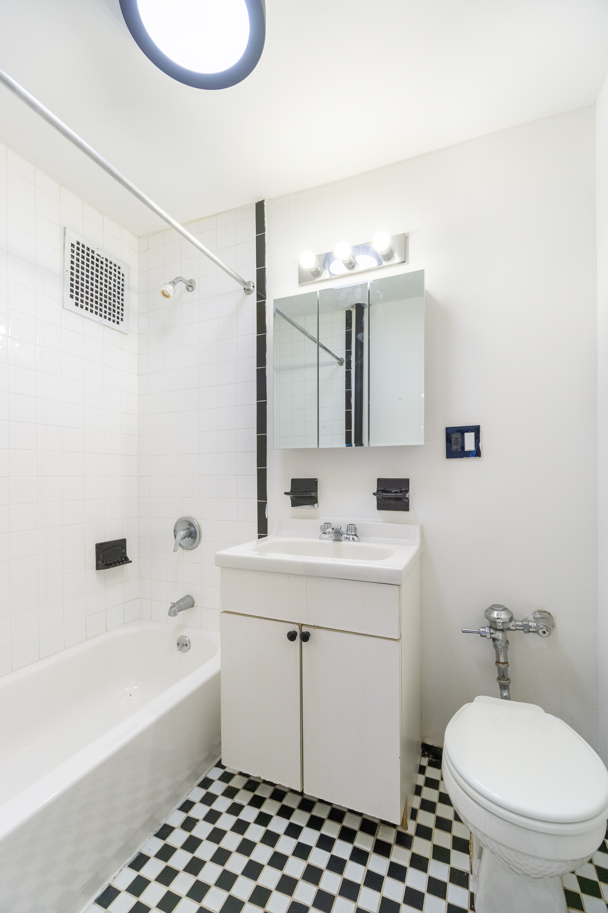 339 East 6th Street, Unit 12 Manhattan, NY 10003 - Photo 6 of 12 a bathroom with a sink a toilet and shower