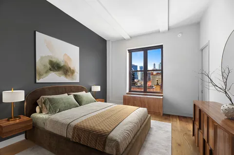 a bedroom with bed and window