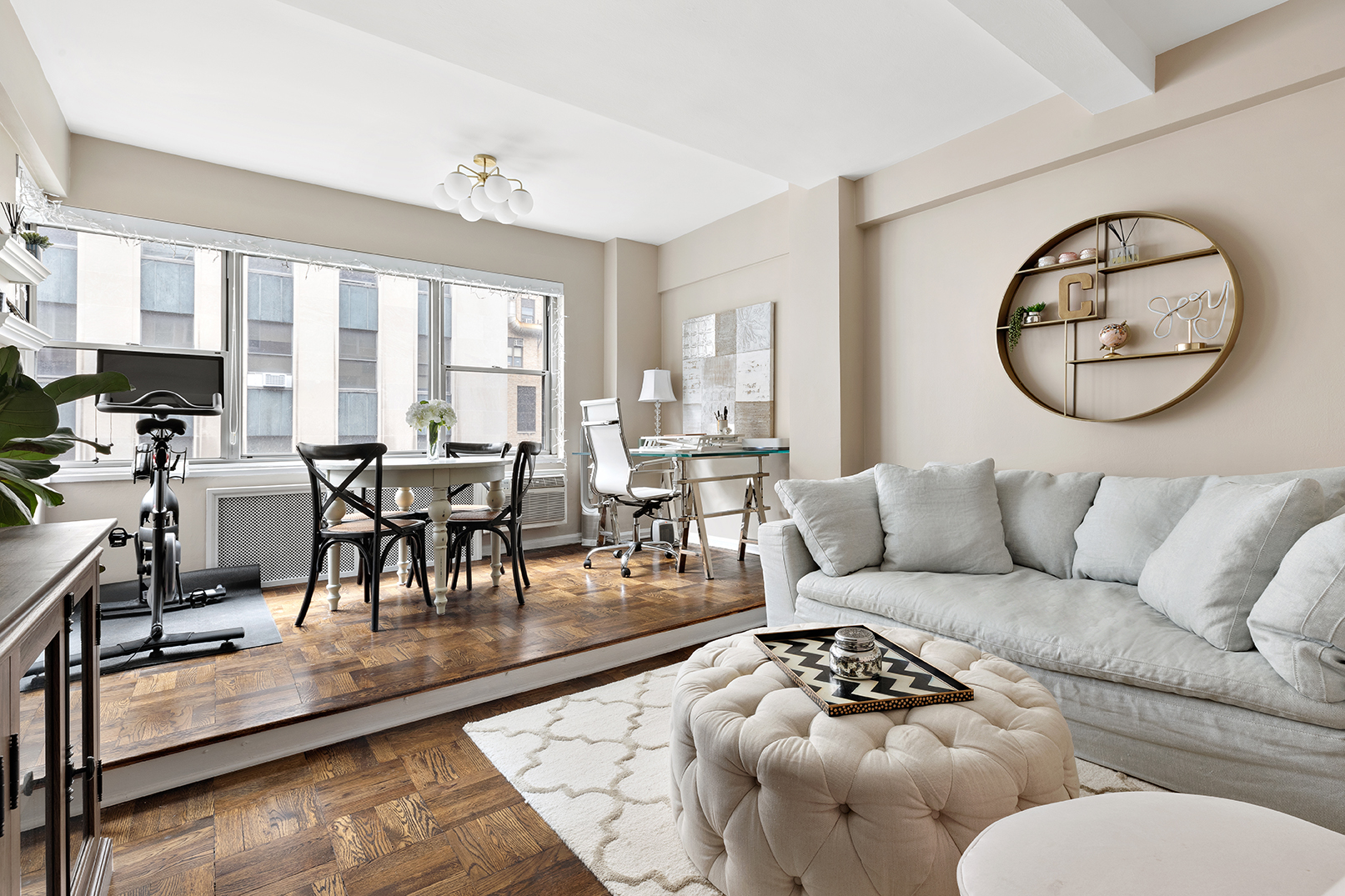 7 Lexington Avenue, Unit 9F Manhattan, NY 10010 - Photo 1 of 8 a living room with furniture and a large window