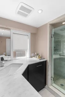 a bathroom with a sink and mirror