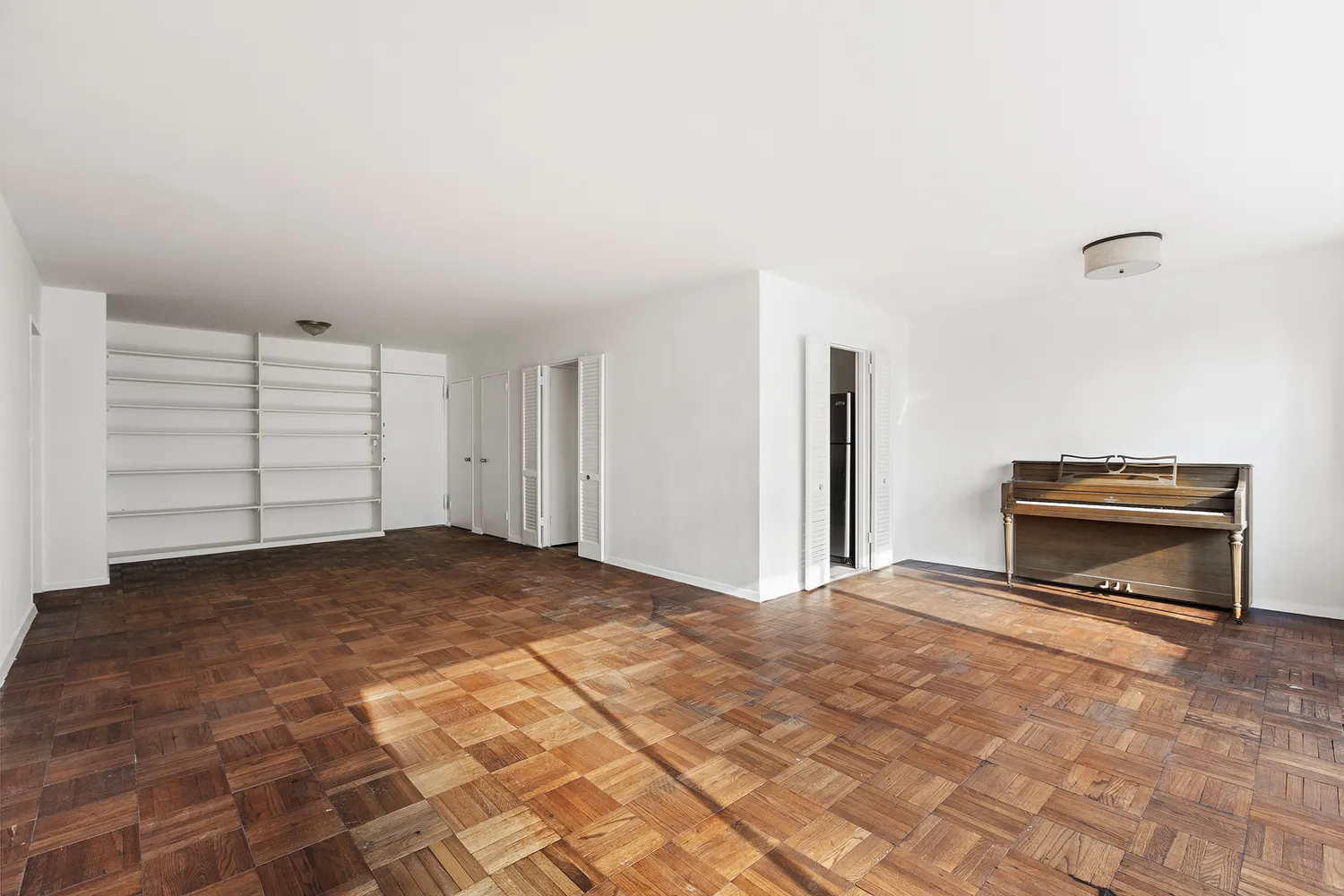 a view of empty room with a fireplace