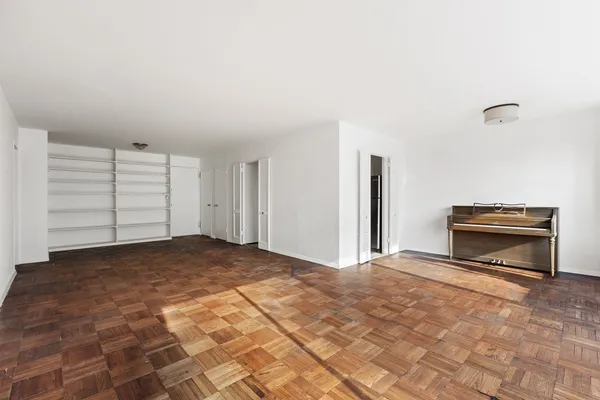 a view of empty room with a fireplace