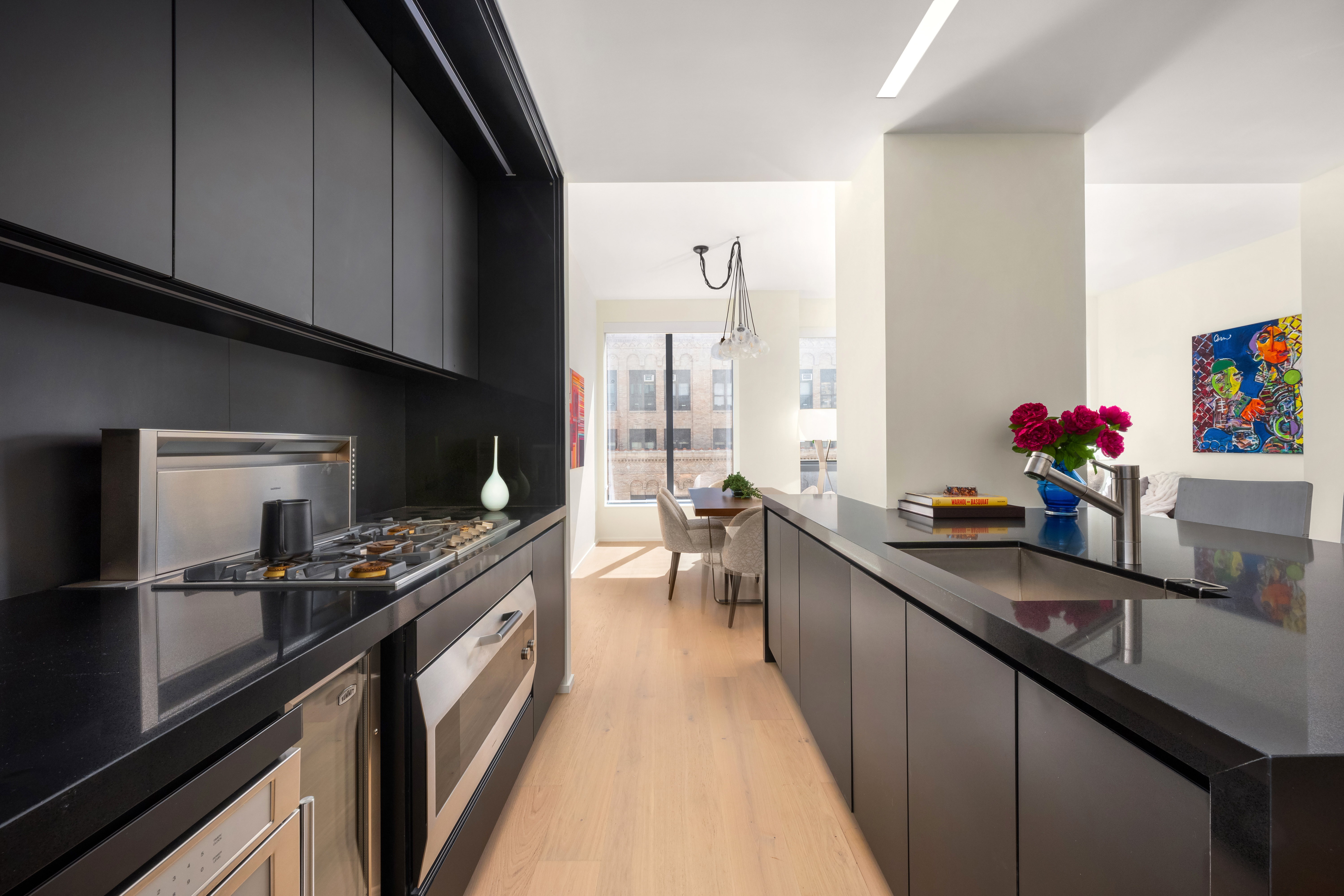121 East 22nd Street, Unit N1405 Manhattan, NY 10010 - Photo 3 of 19 a kitchen with stainless steel appliances a sink dishwasher stove and refrigerator