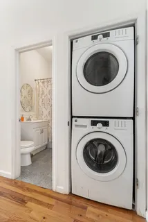 a utility room with sink dryer and washer