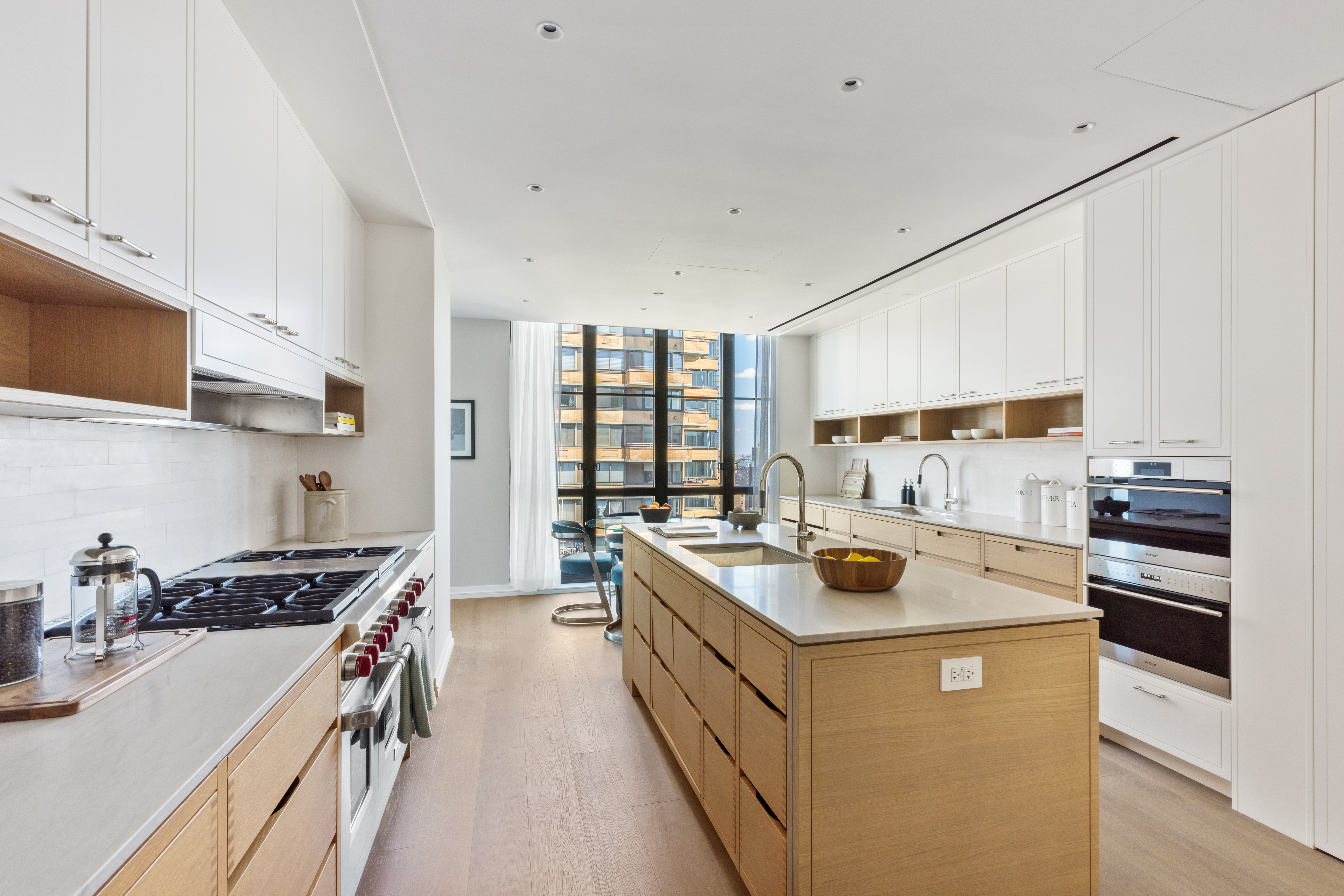 250 West 96th Street, Unit PHA Manhattan, NY 10025 - Photo 5 of 33 a kitchen with a stove sink and cabinets