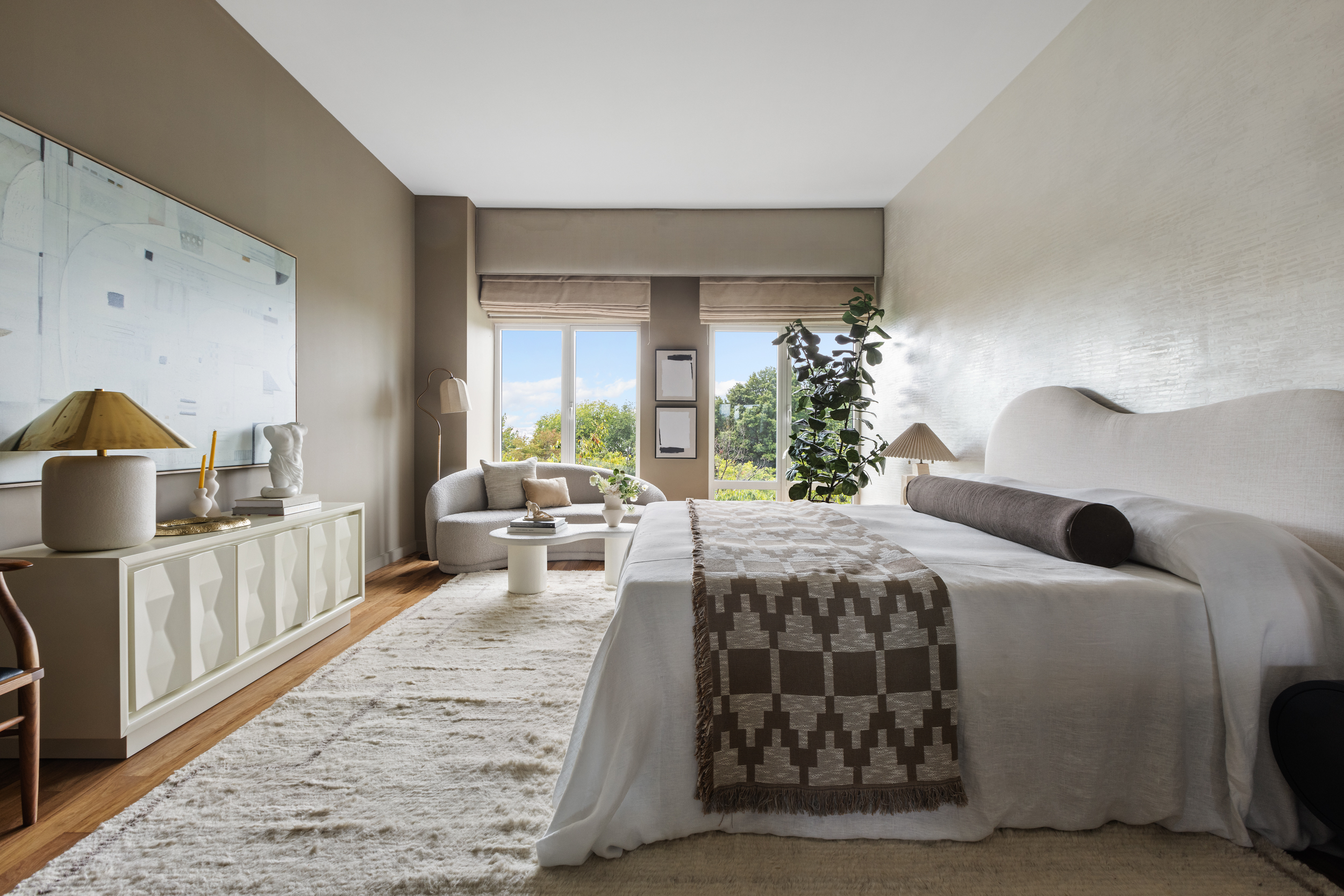 400 West 12th Street, Unit 4E Manhattan, NY 10014 - Photo 13 of 24 a bedroom with a large bed and a view of living room