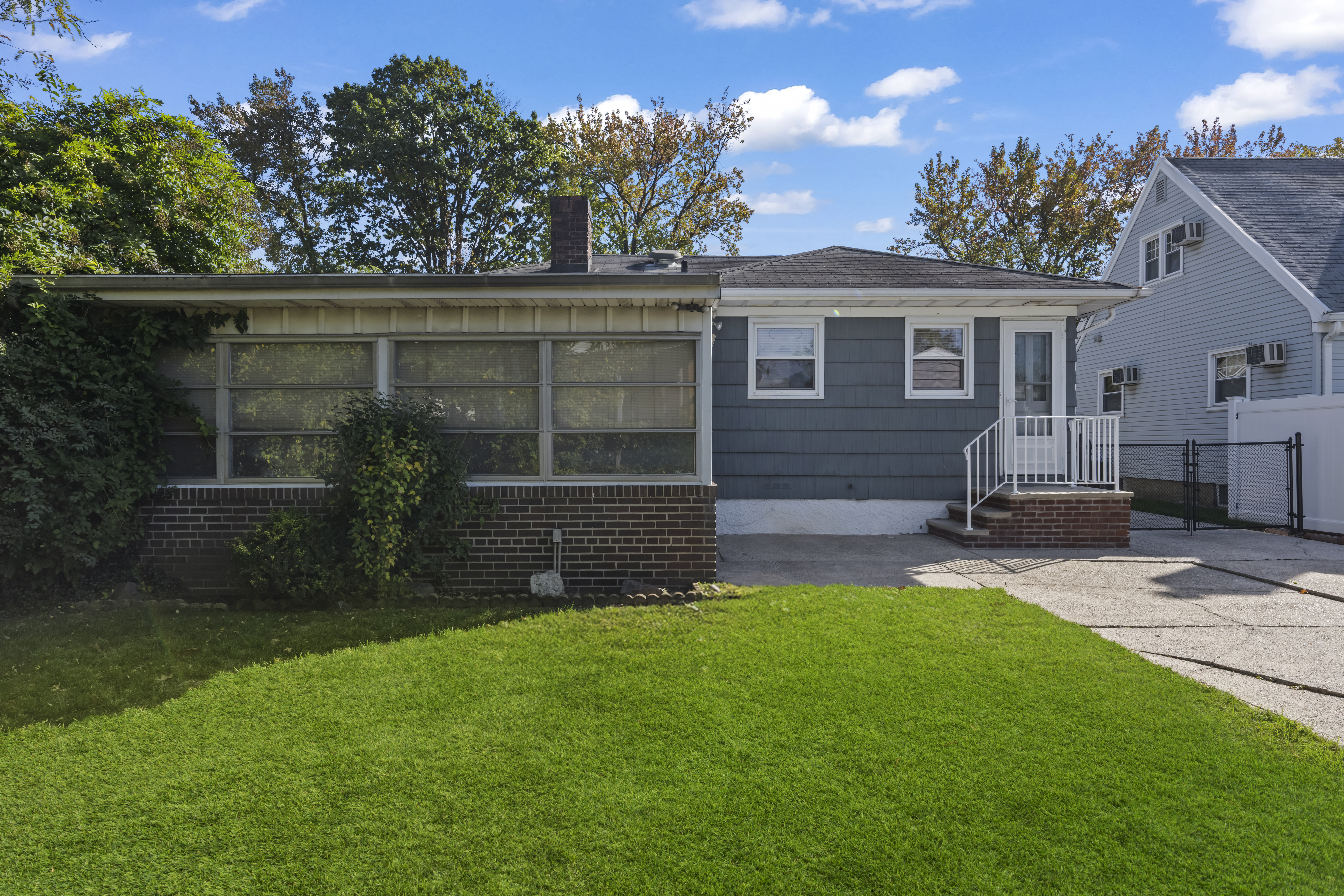 522 Stewart Avenue Staten Island, NY 10314 - Photo 26 of 33 a front view of house with yard and outdoor seating