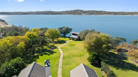 a view of swimming pool with outdoor seating and yard in back