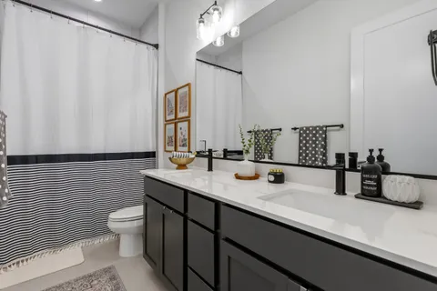 a bedroom with bed and a window