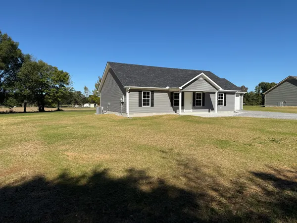 a front view of a house with a yard