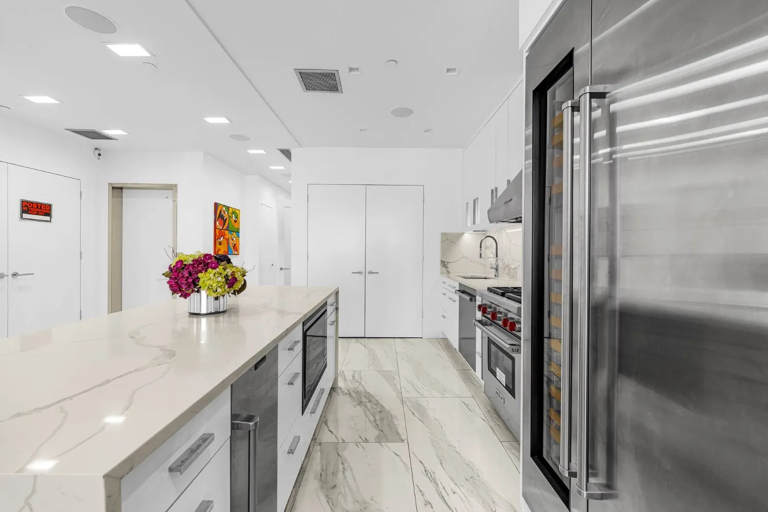 a hallway with a white stove top oven and a refrigerator