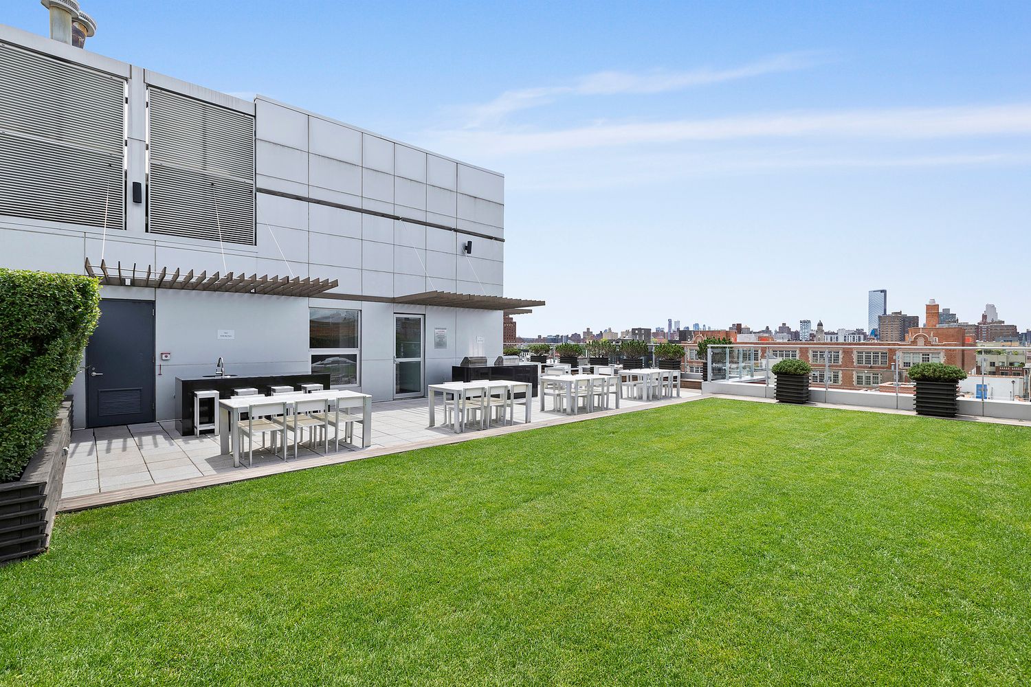 425 East 13th Street, Unit PHFG Manhattan, NY 10009 - Photo 27 of 31 a view of a house with a backyard and a patio