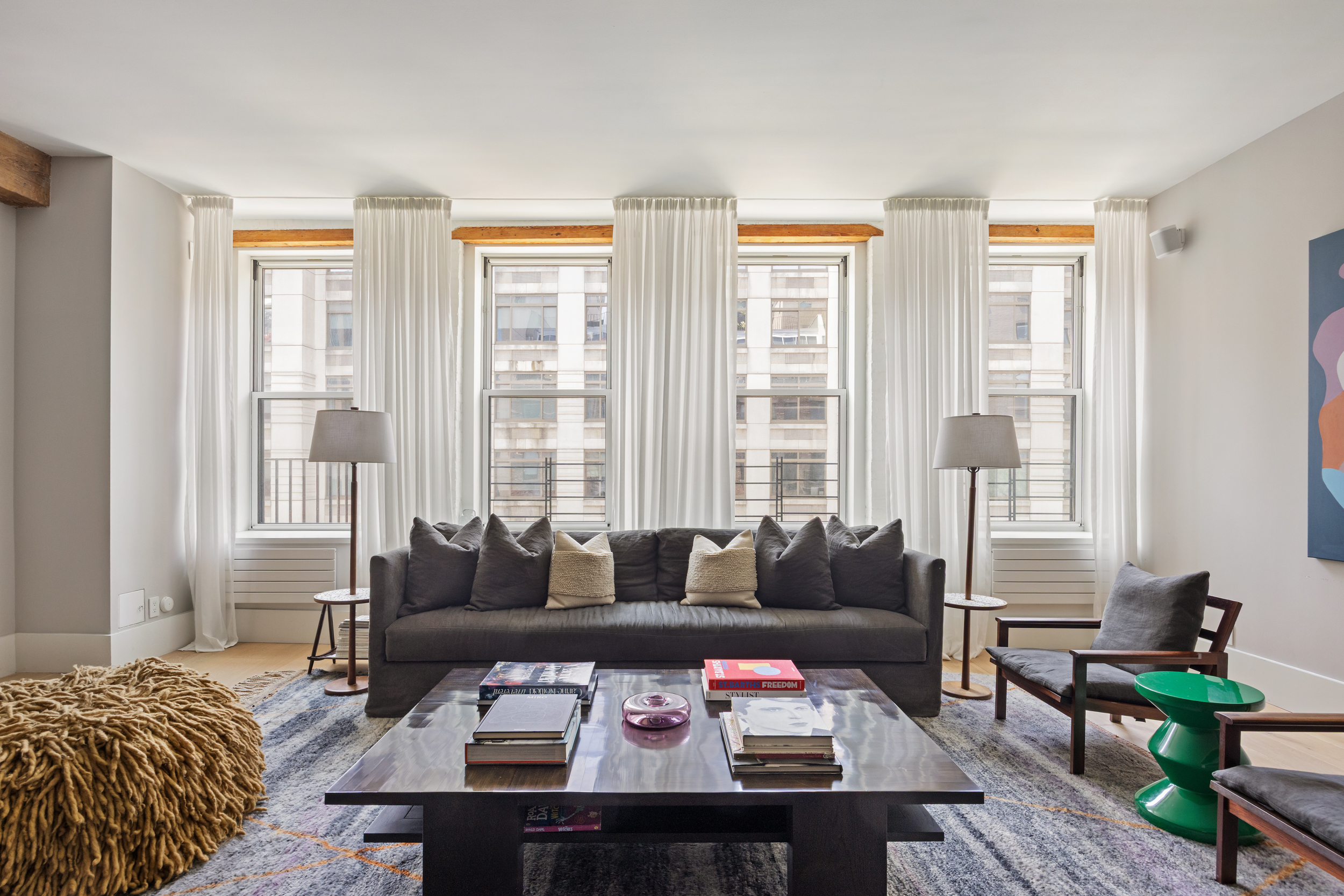 622 Greenwich Street, Unit 4B Manhattan, NY 10014 - Photo 3 of 27 a living room with furniture and a large window