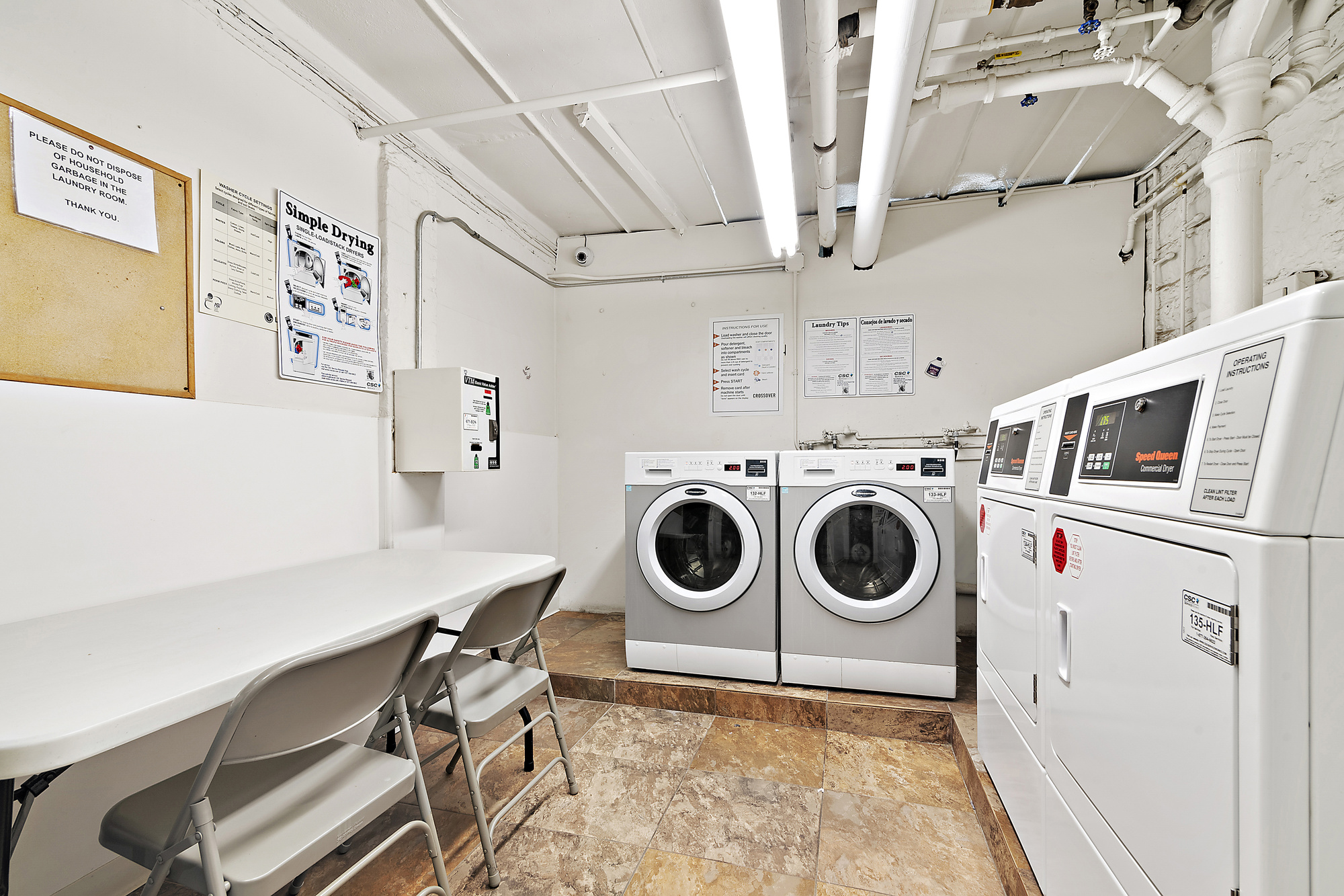 350 West 56th Street, Unit 1A Manhattan, NY 10019 - Photo 7 of 17 a utility room with dryer and washer