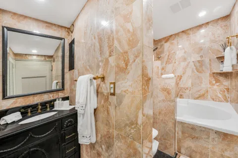 a bathroom with a sink and mirror