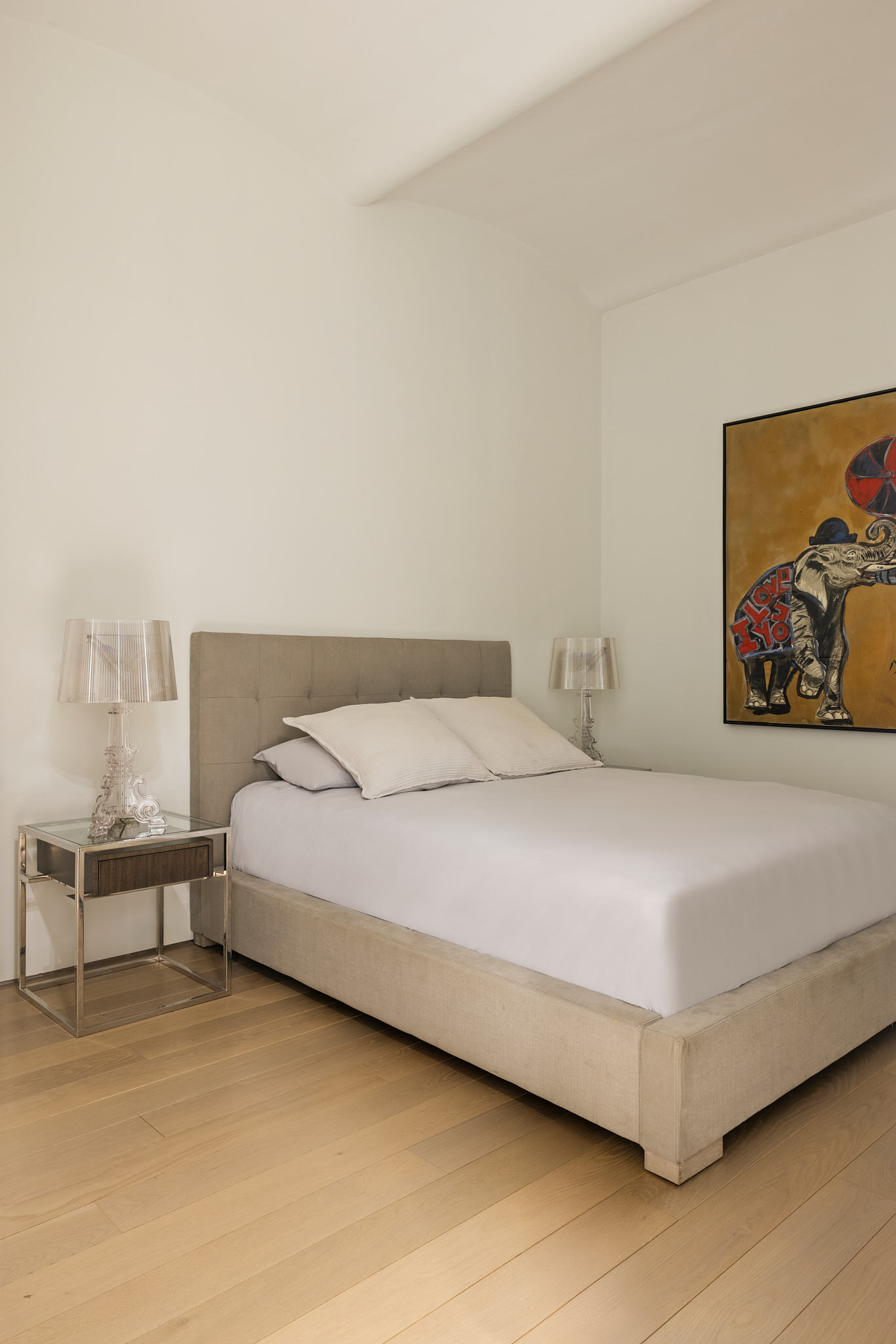 543 Broadway, Unit 6 Manhattan, NY 10012 - Photo 9 of 13 a bedroom with a bed and a painting on the wall