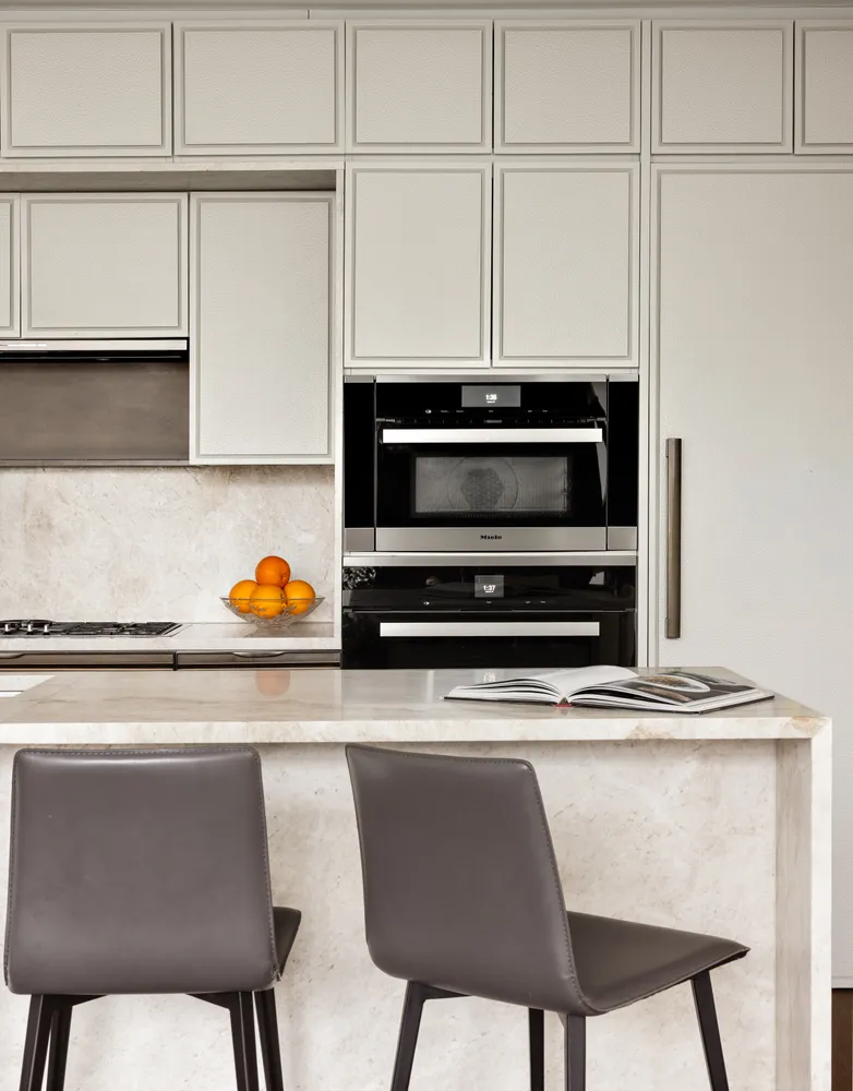 a kitchen with stainless steel appliances granite countertop a sink and a stove