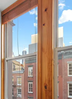a bathroom with a granite countertop sink a mirror and a bathtub