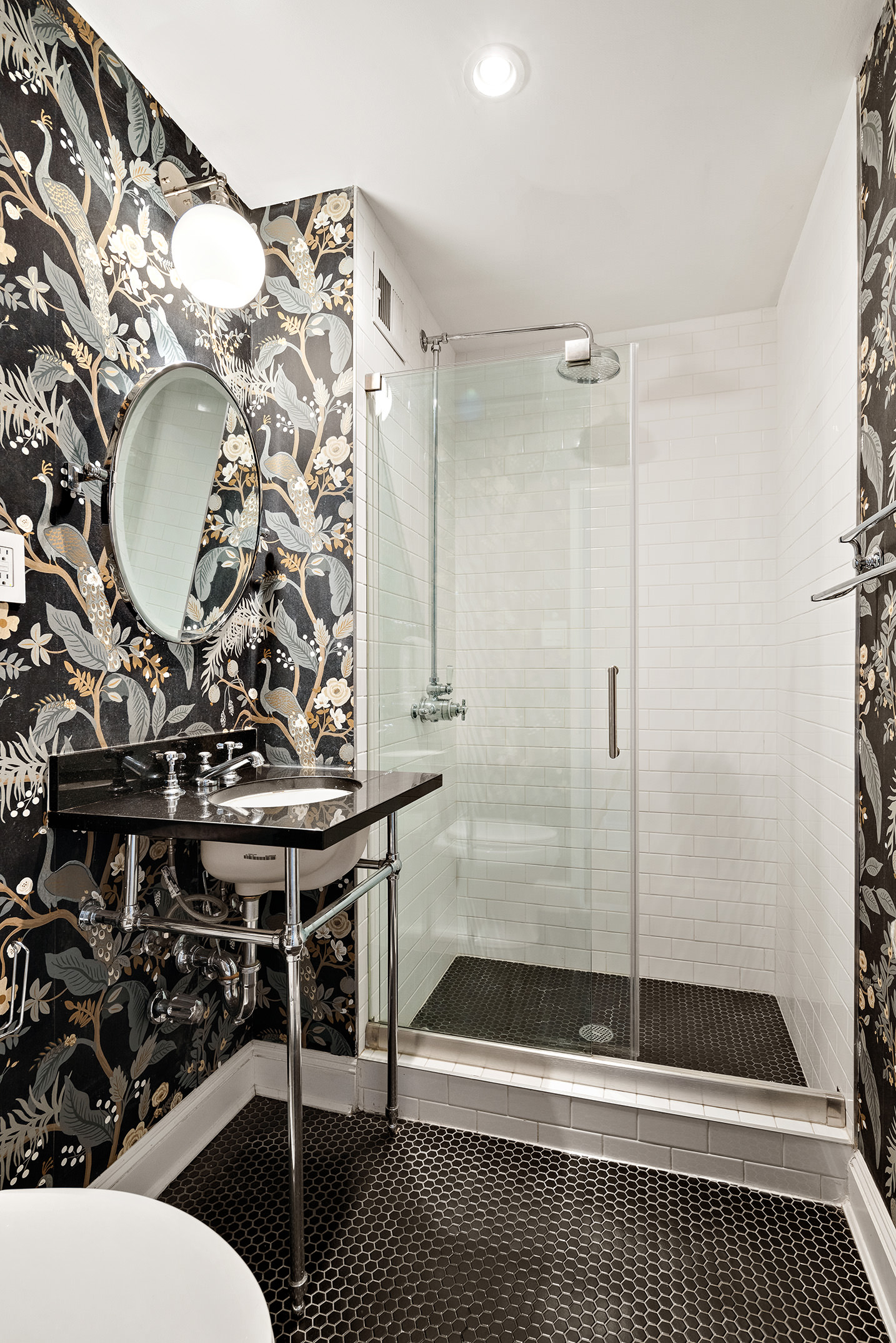 1 Tiffany Place, Unit 2F Brooklyn, NY 11231 - Photo 7 of 12 a bathroom with a sink a mirror and a shower
