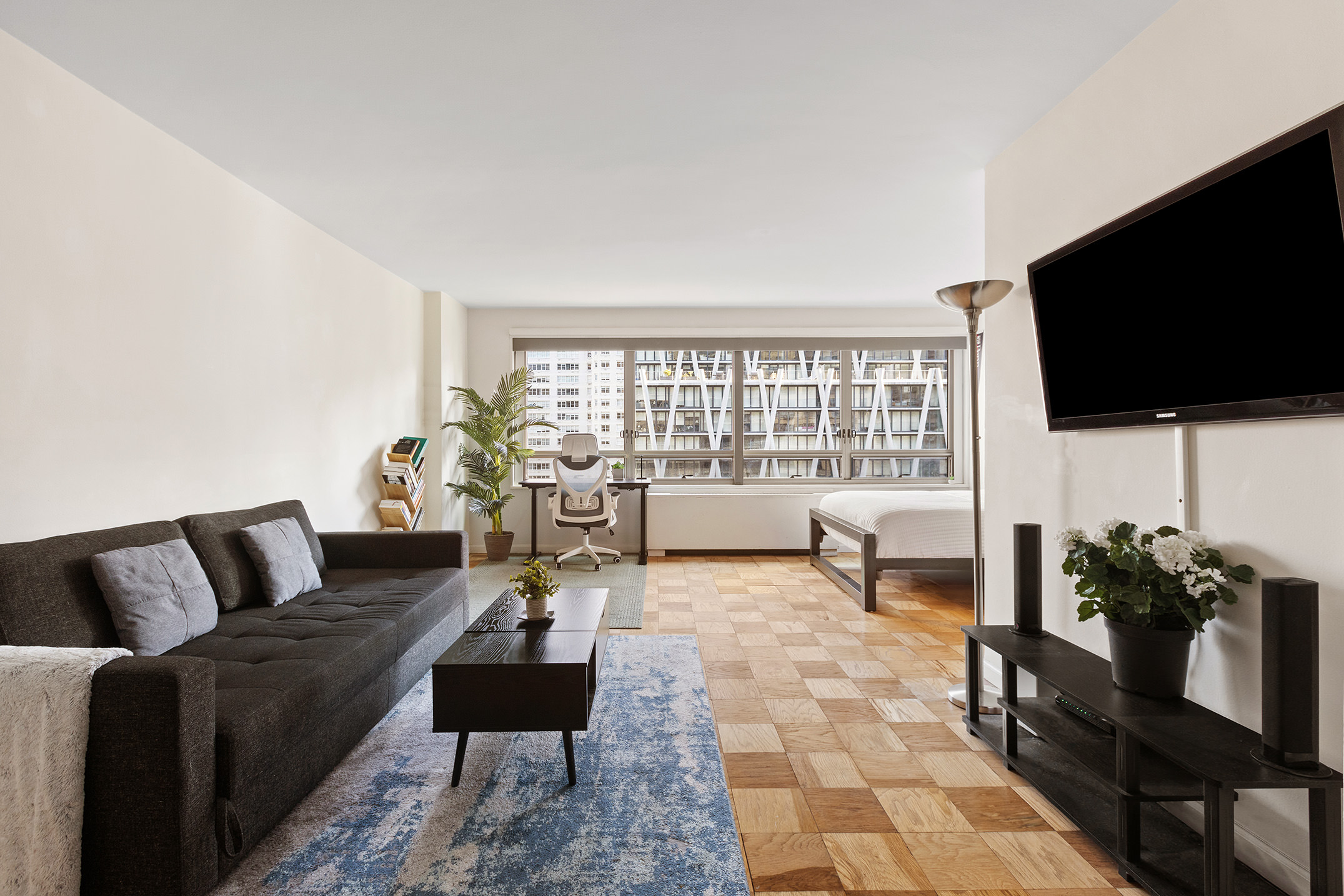 a living room with furniture and a flat screen tv