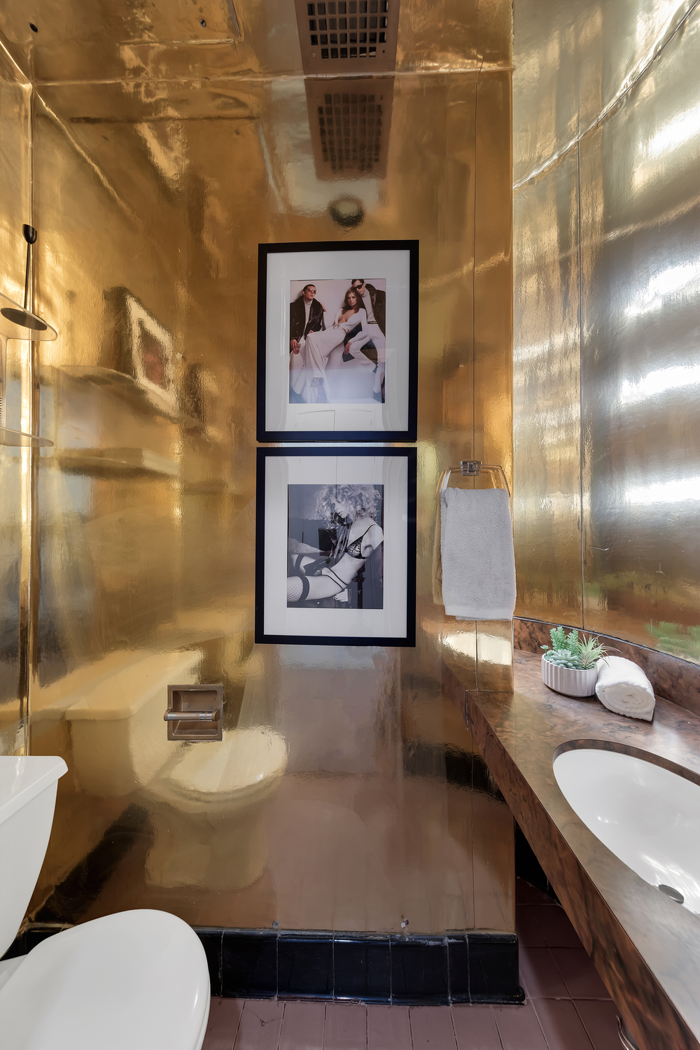 206 East 30th Street Manhattan, NY 10016 - Photo 7 of 17 a bathroom with a granite countertop sink and a mirror