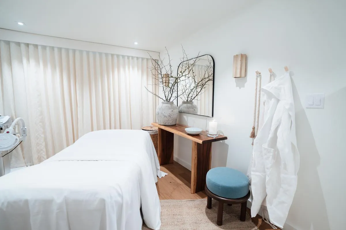 a bathroom with a toilet sink and shower