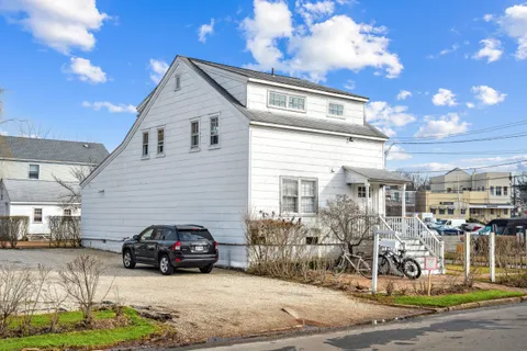 a view of a car park in front of house