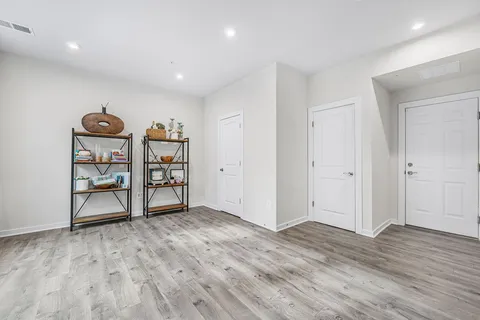 a view of a room with wooden floor and closet