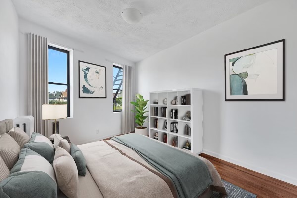 7609 4th Avenue, Unit B1 Brooklyn, NY 11209 - Photo 3 of 17 a bedroom with a bed and a window