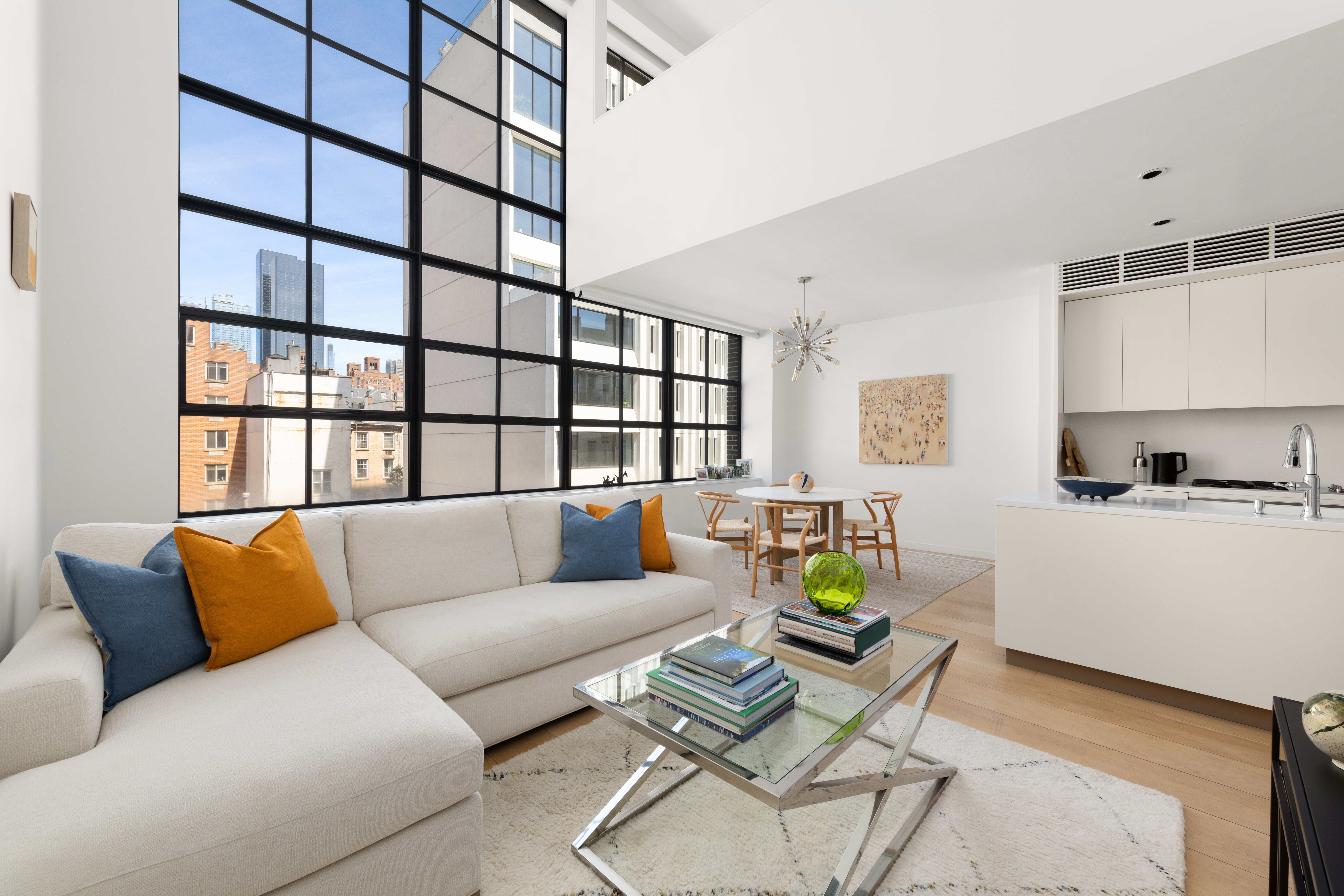 456 West 19th Street, Unit 4/5A Manhattan, NY 10011 - Photo 7 of 15 a living room with furniture and a window